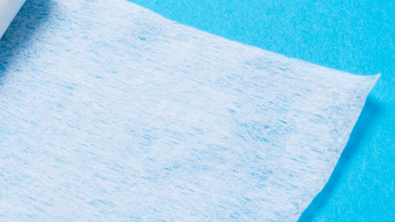 Precision in Filtration: Closeup of Palas Filter Media Test Rig on Blue Background Closeup of a filter media test rig by Palas, placed on a blue background, used for testing the depth of filter media, coalescing and cleanable surface filter media.