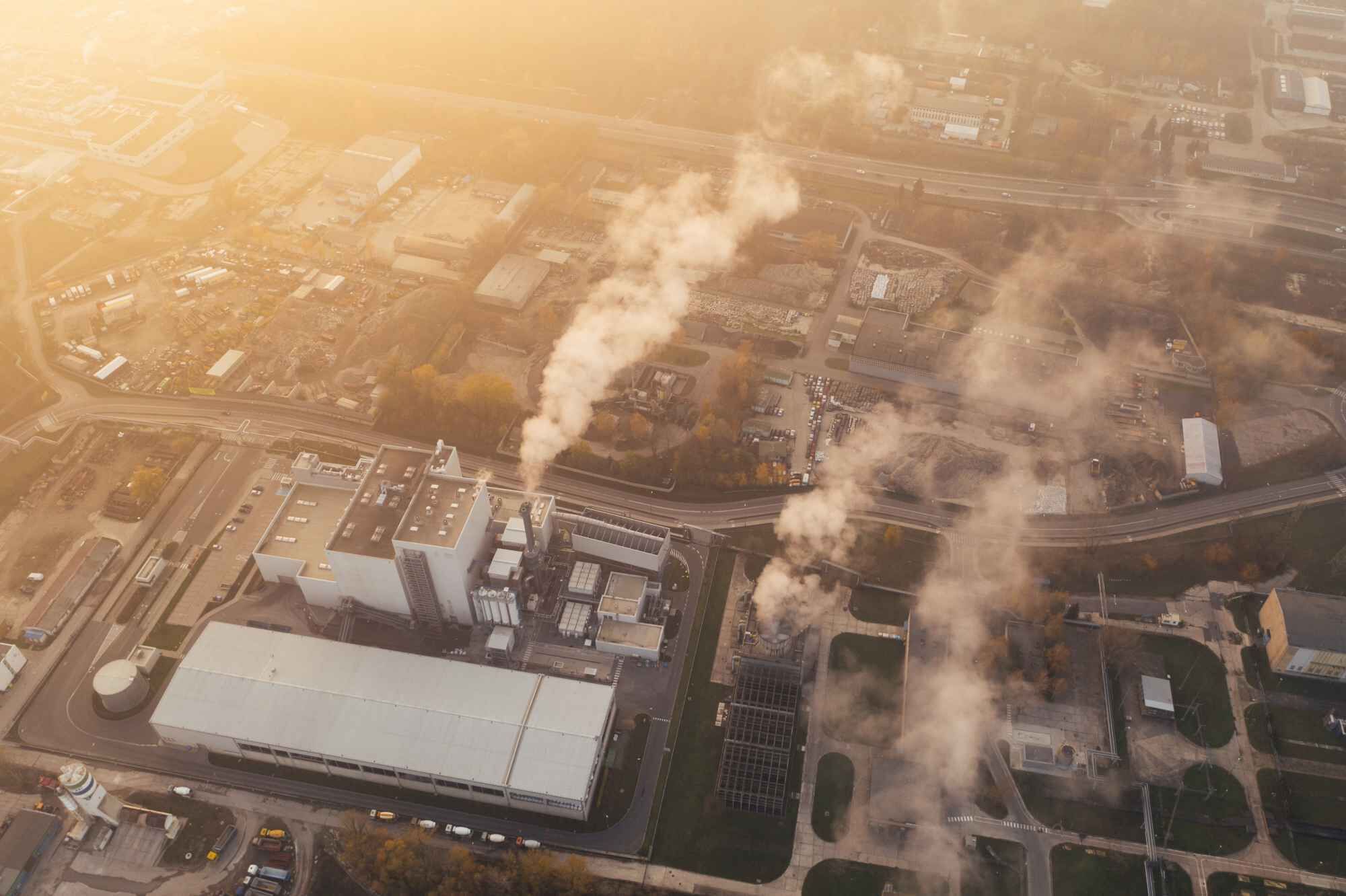 Aerial shot of an industrial zone and smoking chimneys of factories: Palas&reg; strives to offer smart solutions in order to protect human health by using air quality networks and innovative measuring devices.
