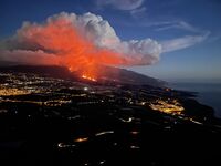 Dramatic image capturing the eruption of Cumbre Vieja on La Palma. Glowing lava flows down the volcano, while massive ash clouds billow into the sky. Palas has installed air quality monitoring devices to assess the impact on the atmosphere.