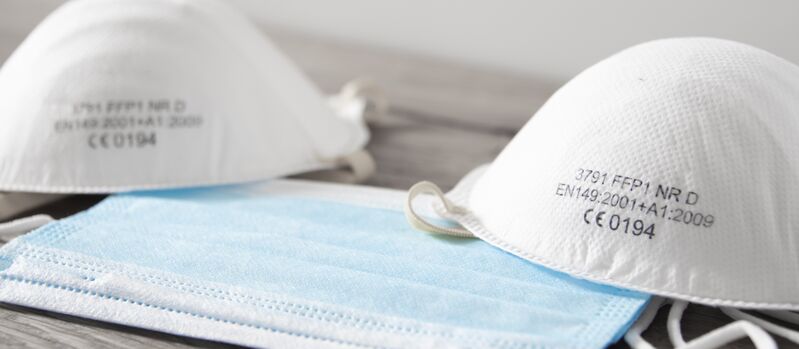 FFP2 and protective face masks Closeup of two FFP2 and one surgical face mask in front of a white-gray background. Palas enables testing of respiratory masks to continuously optimize the quality and standards.