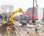 Construction site in a German city featuring fine dust monitoring devices for environmental safety