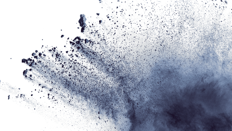 Closup of black particles exploding and spreading in front of a white background. Palas Aerosol Spectrometers measure particle size and particle concentration.