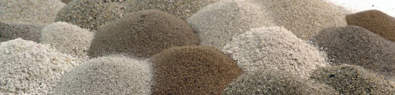 Dust in different colors Several little heaps of dust in different light and brown tones next to one another, measured by the Palas Process Monitor for quality assurance and online process monitoring.